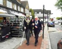 The Mayor and Lion President Martin navigate the streets